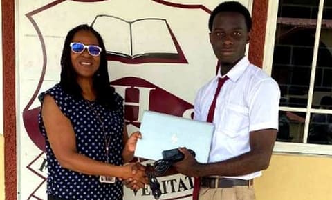 A NY Chapter representative presenting a scholarship to a Glenmuir student